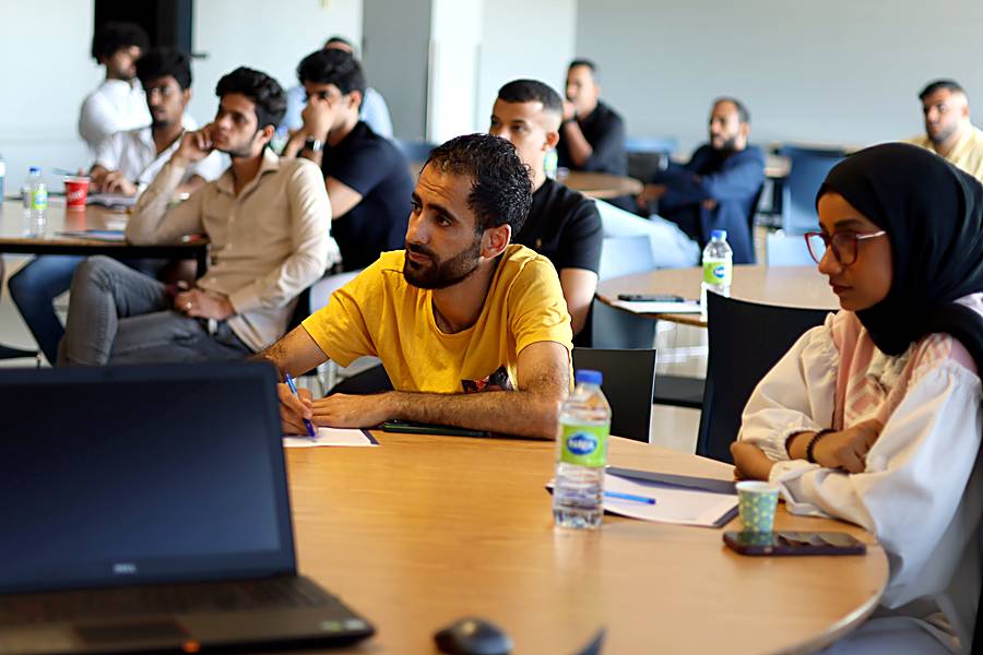 Attendees listening during a Cayan workshop